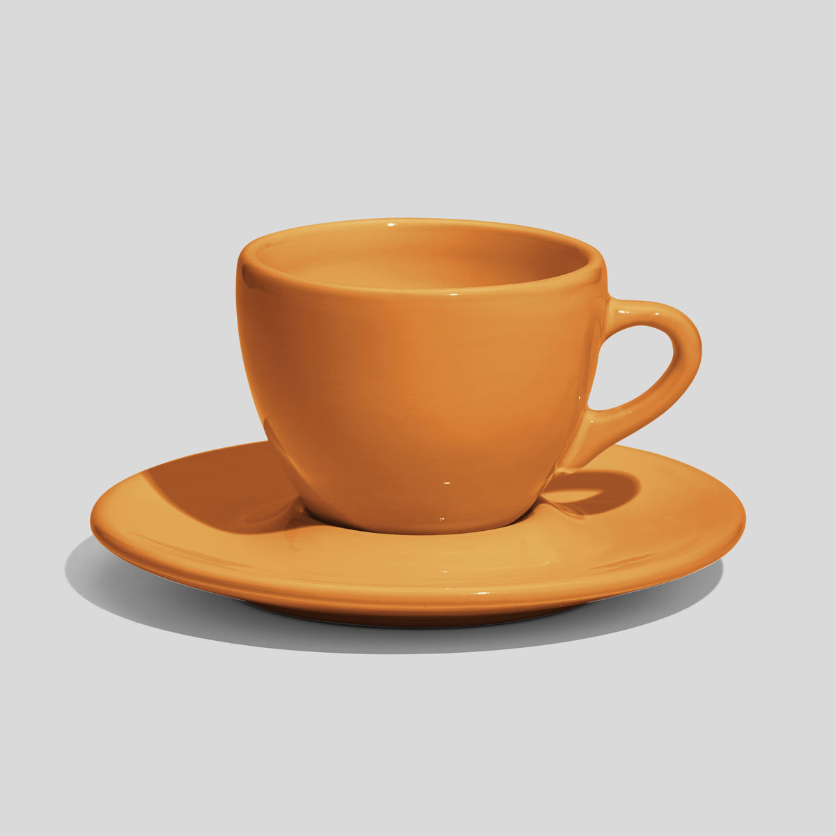 Breite Tasse mit Untertasse 160 ml und Bogenhenkel – Senfgelb