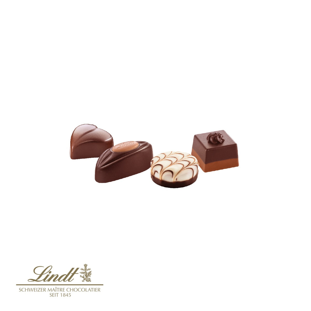Geöffnete Box mit Lindt Pralinés Kleine Kostbarkeiten