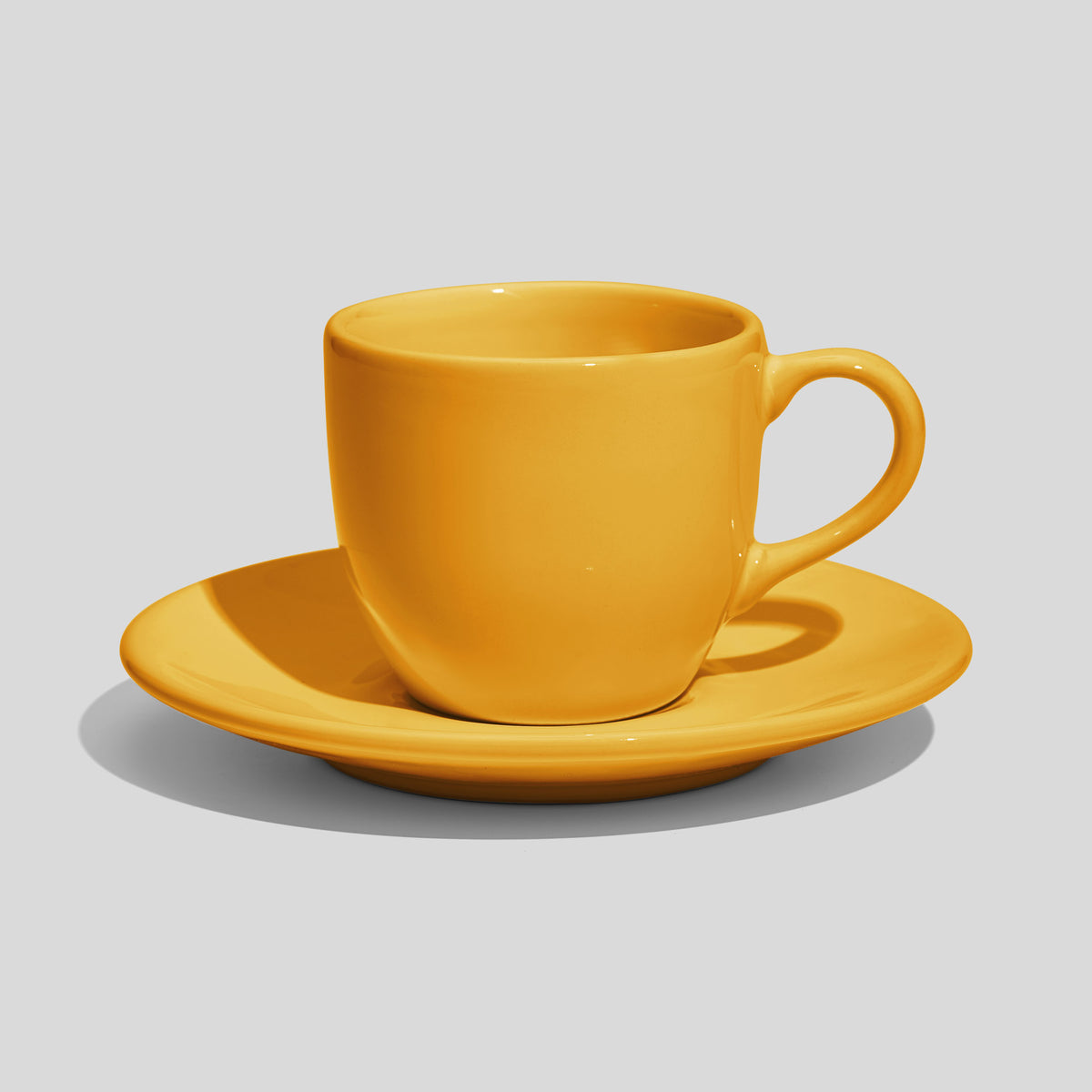 Rundliche Tasse mit Untertasse 180 ml und Bogenhenkel – Gelb