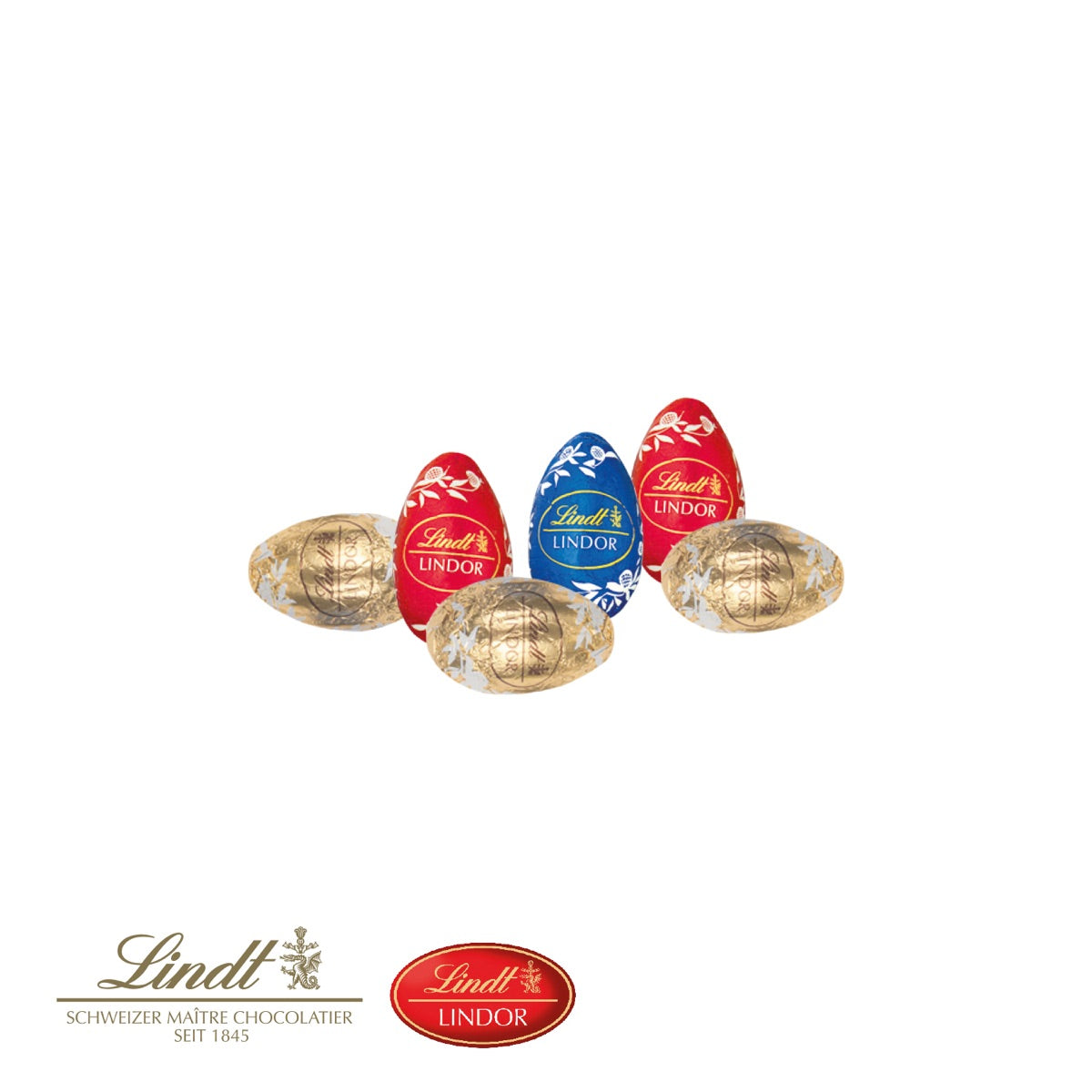 Sechs Schokoladeneier von Lindt auf dem Einleger im Ostergras Design