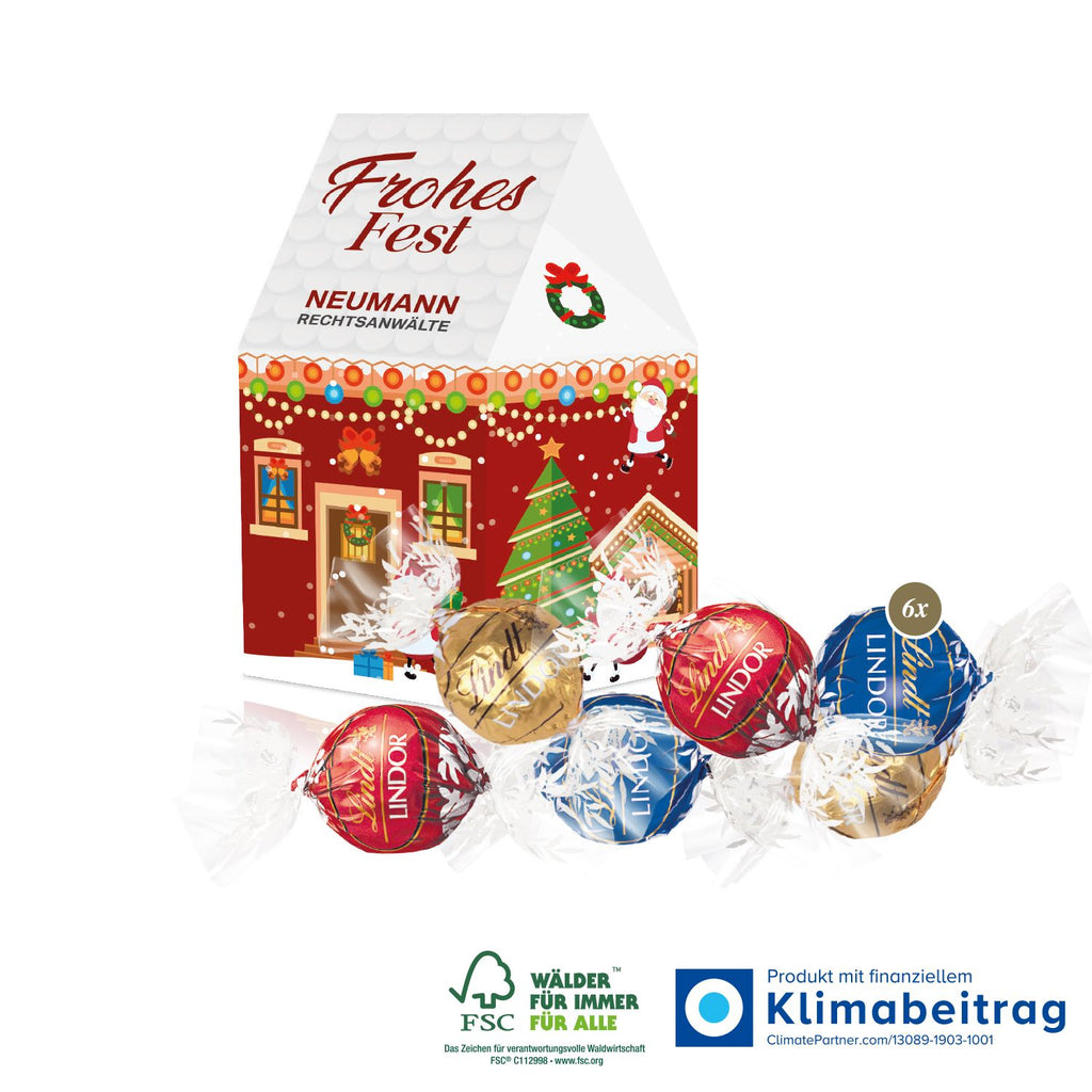 3D Präsent Haus mit Lindt Lindor Pralinés, FSC®-zertifiziert und ideal als festliches, nachhaltiges Weihnachtsgeschenk für Kundinnen und Mitarbeiterinnen.