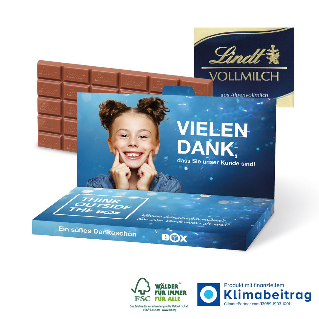 Grußkarte mit einer 100 g Schokoladentafel von Lindt, individuell verpackt und bereit zum Verschenken.