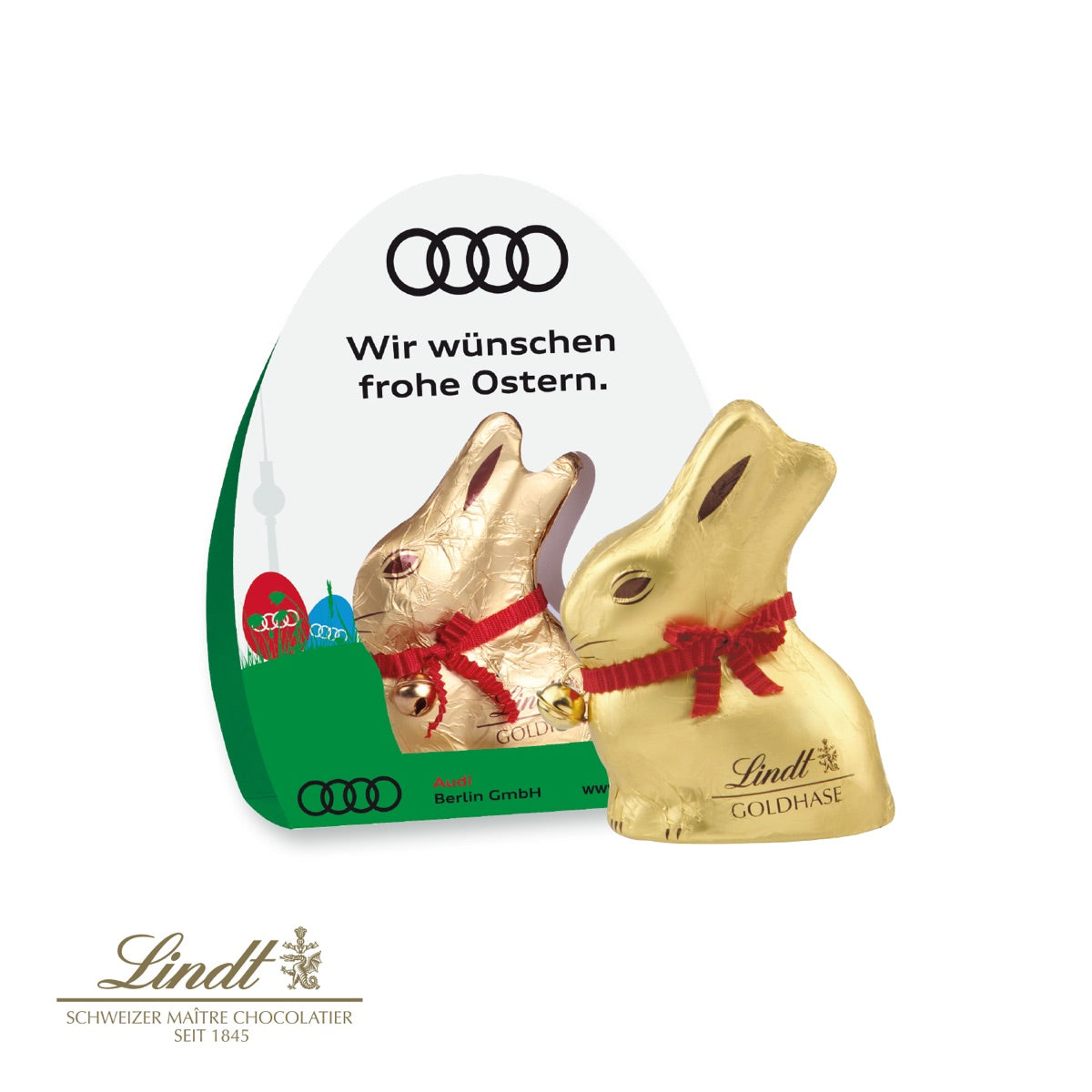 Werbekartonage aus Karton, rundum bedruckt mit Logo und Ostermotiv