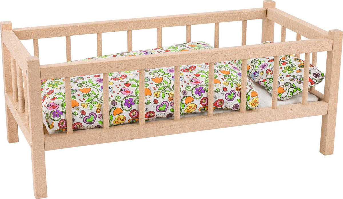 Puppenbett aus hellem Holz mit Stäben, 60 cm lang – Ansicht