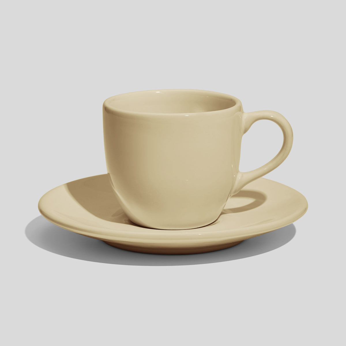 Rundliche Tasse mit Untertasse 180 ml und Bogenhenkel – Beige