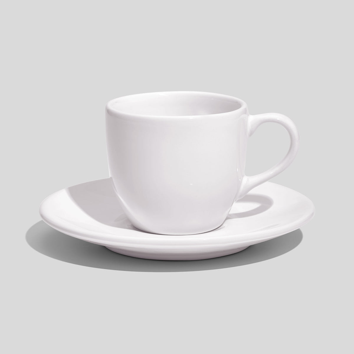 Rundliche Tasse mit Untertasse 180 ml und Bogenhenkel – Weiß