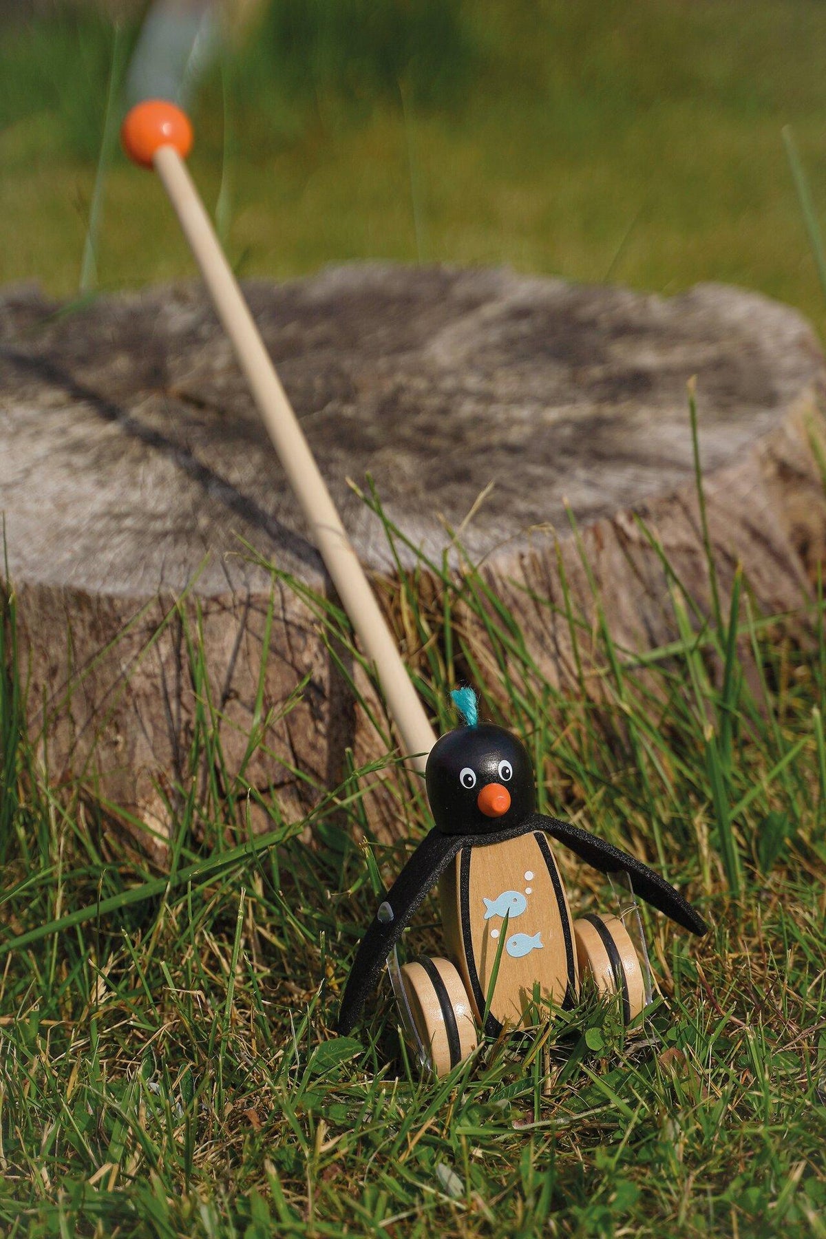 Schiebetier Pinguin Pablo mit Filzflossen und Fischmotiv