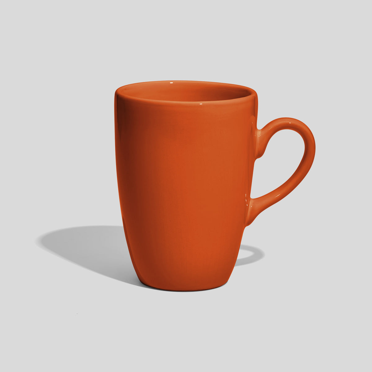 Schlanke Keramiktasse 330 ml mit geschwungenem Henkel – Orange